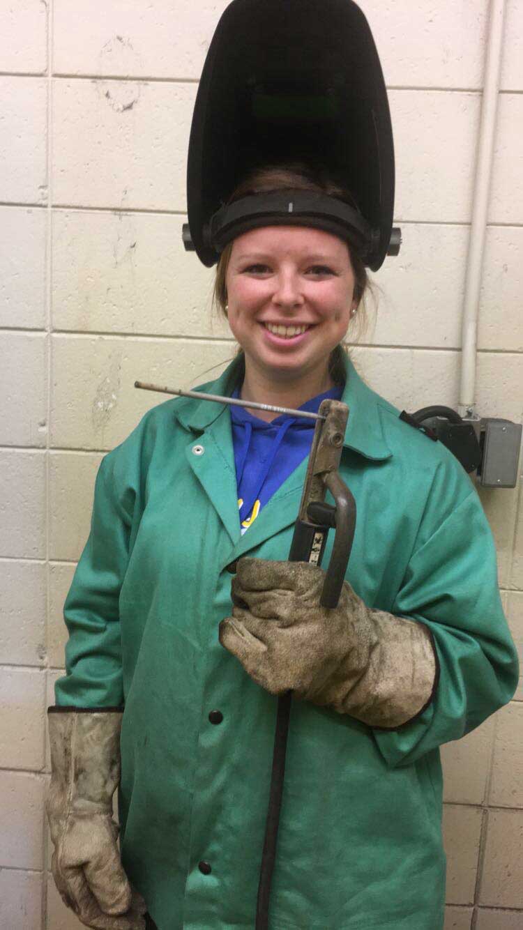http://Grower%20Ashleigh%20smiling%20while%20welding