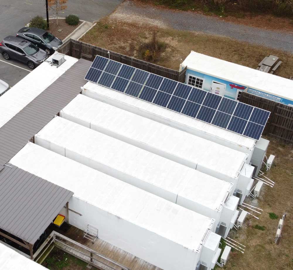 http://Solar%20panels%20on%20top%20of%20a%20AmplifiedAg%20container%20farm%20on%20a%20Vertical%20Roots%20farm%20in%20Charleston,%20SC